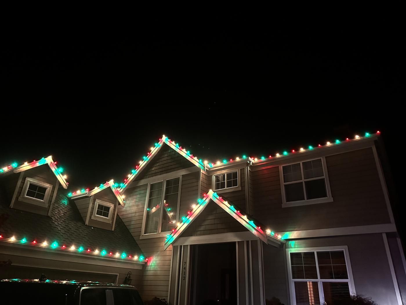 Red and green lights on several rooflines