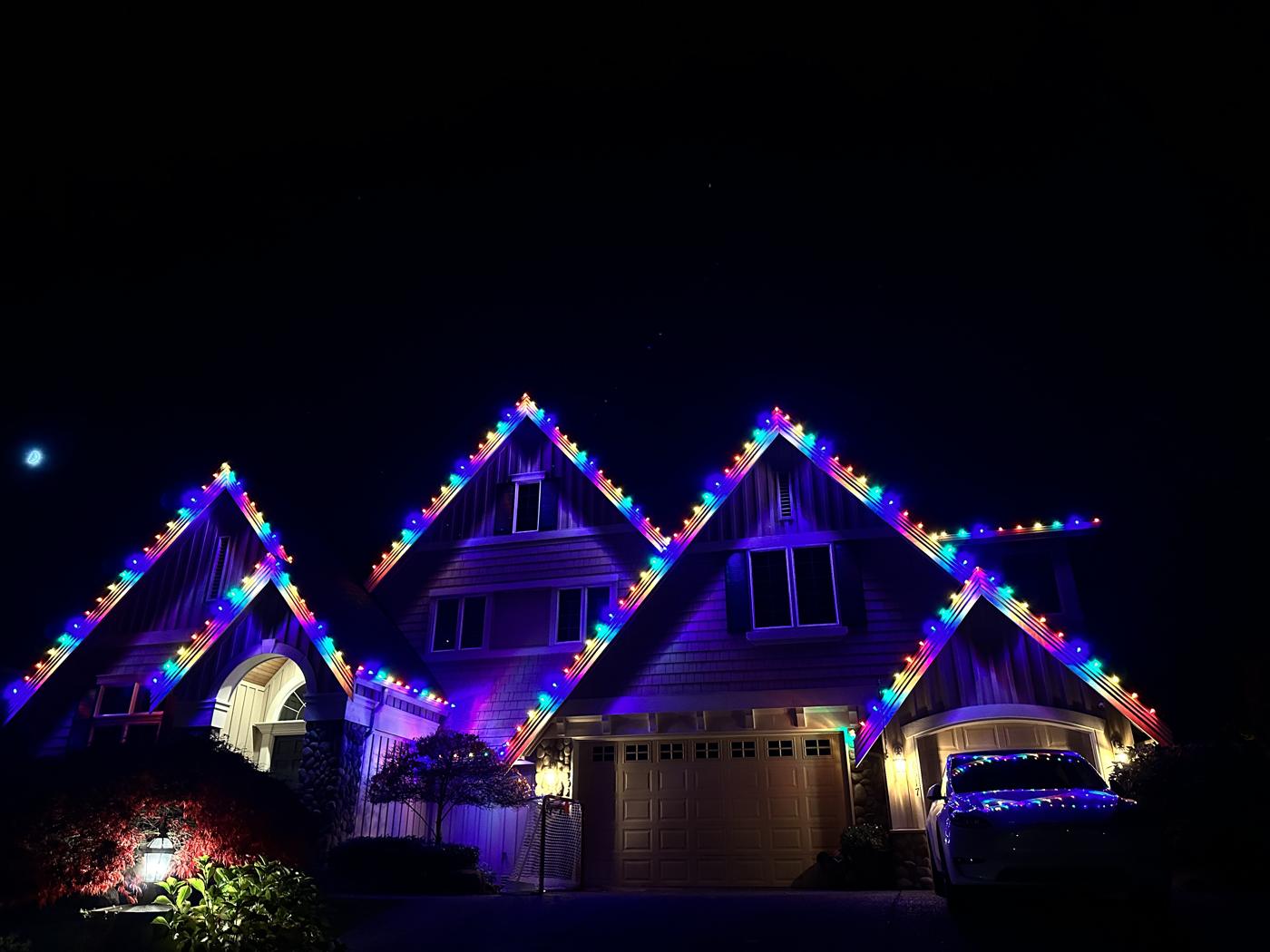 Multicolor lights on every gable of a large home
